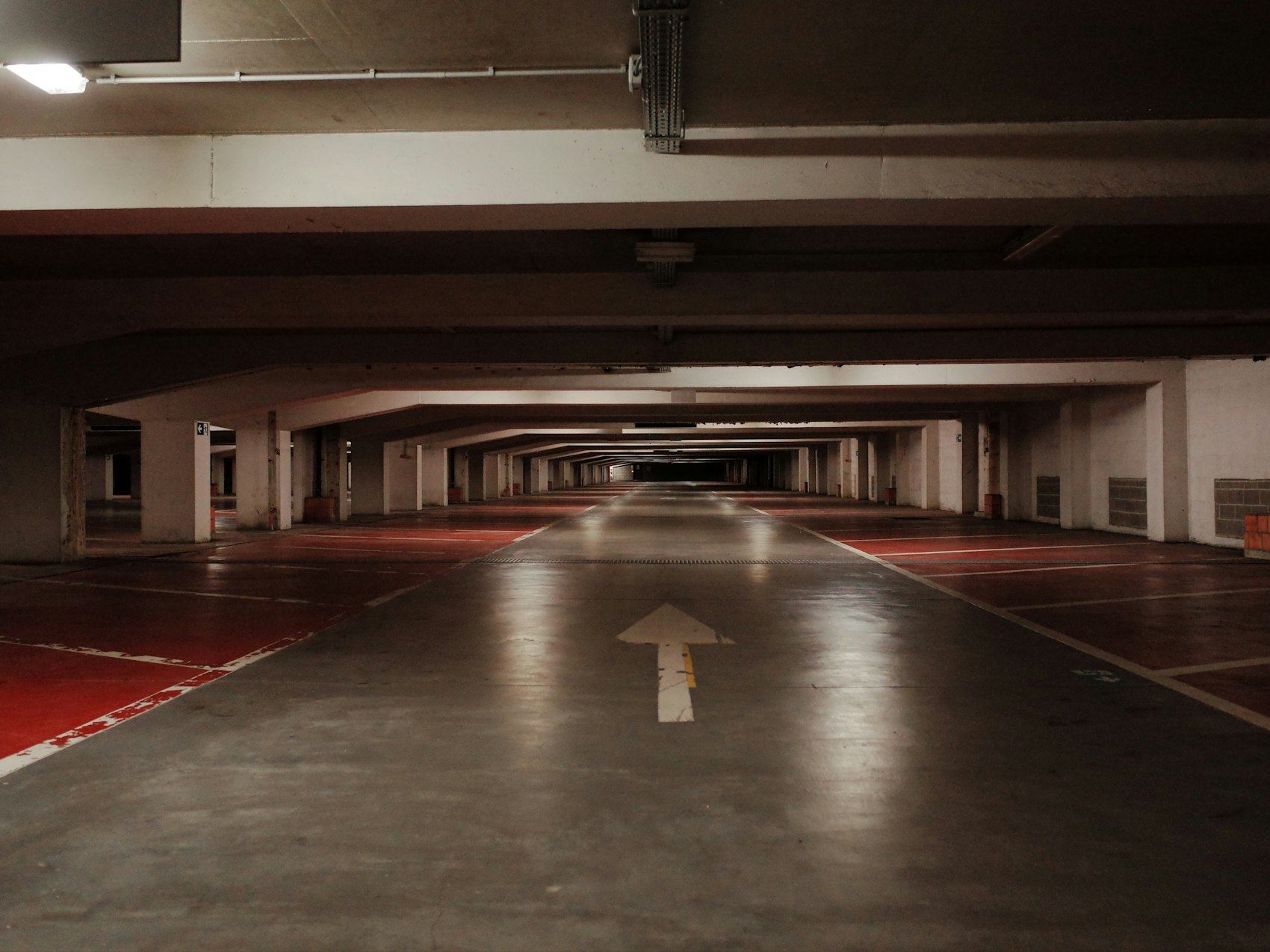 Empty parking garage with red floor markings
